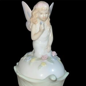 6.25 Inch Glazed Porcelain Pink Trinket Box with Kneeling Fairy on Lid